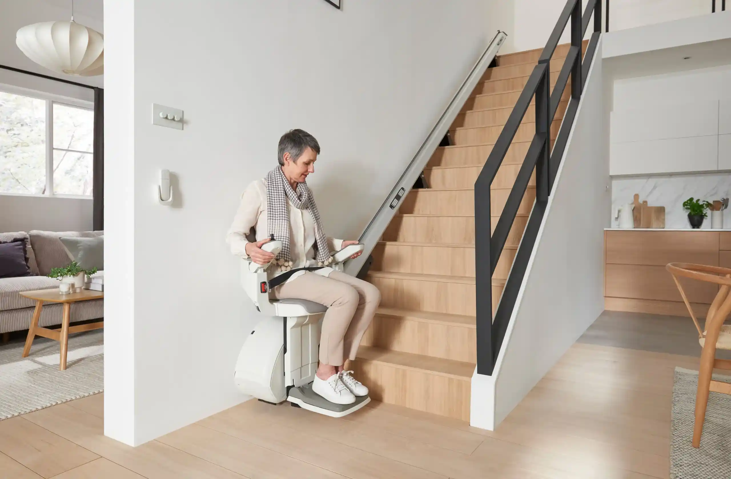 woman sitting on HomeGlide Extra Straight Stairlift