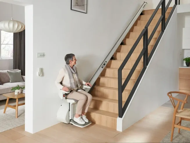 woman about to be lifted by HomeGlide Extra Straight Stairlift