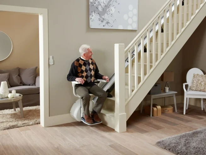 old man sitting on Straight Reconditioned Stairlifts seat
