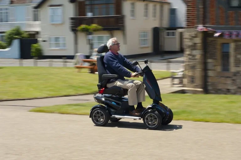Old man driving a mobility scooter