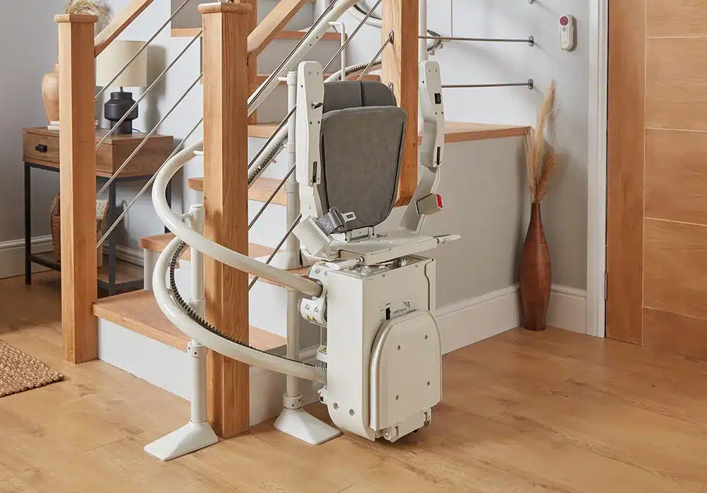 Stairlift folded away at the bottom of the stairs