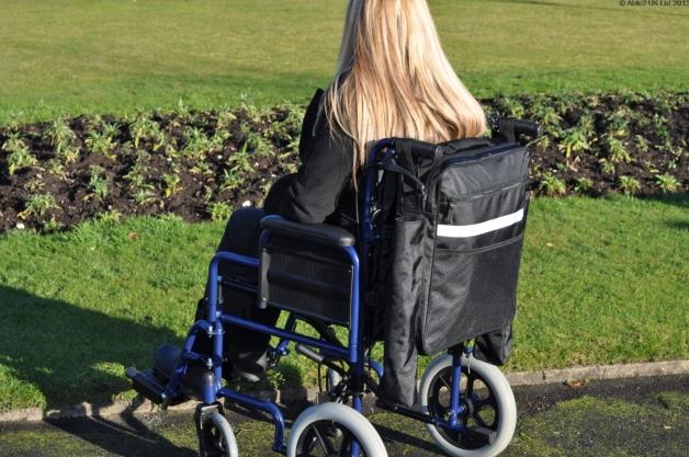 Woman sitting on a wheelchair