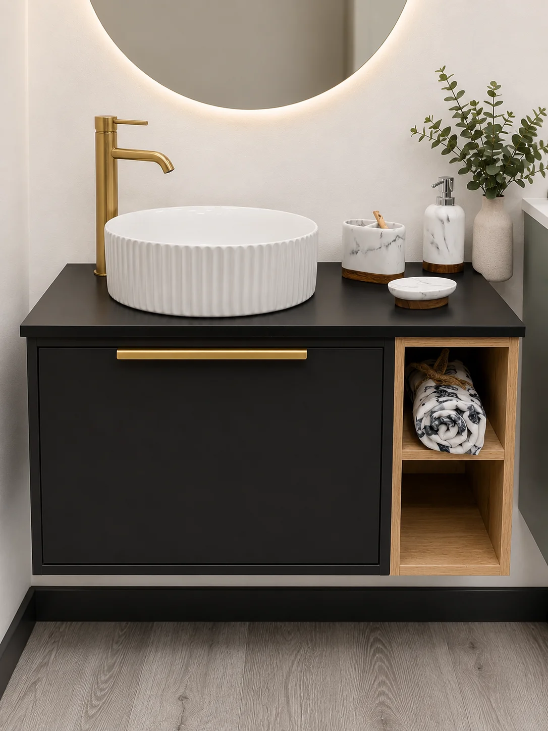 Matt black wall-hung vanity unit with fluted countertop basin and brushed gold tap