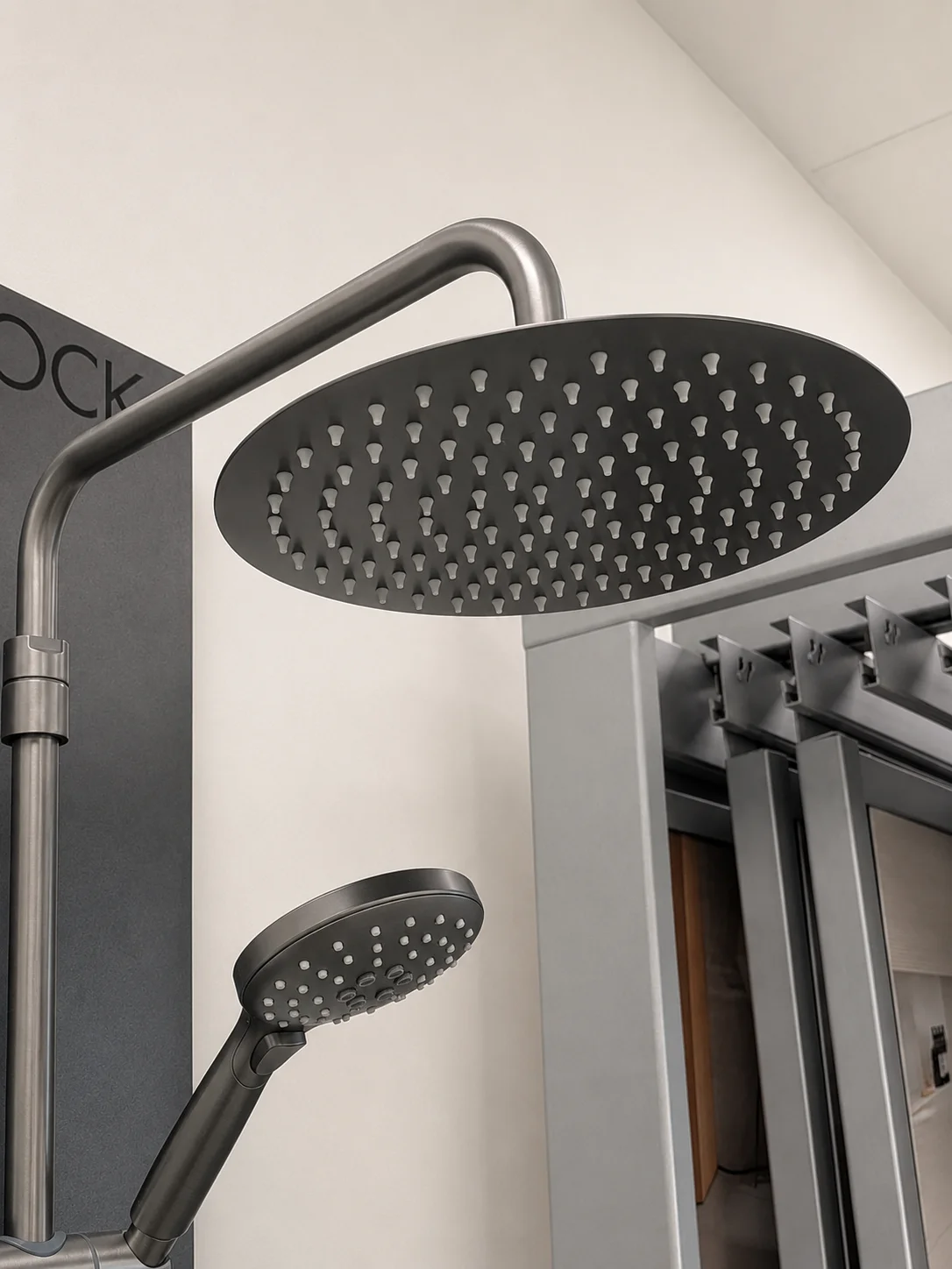 Gunmetal grey rainfall shower head with matching hand shower