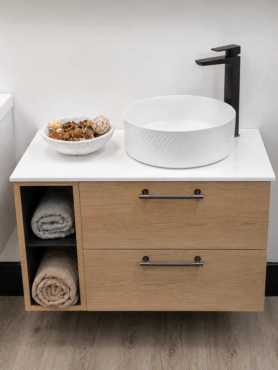 Oak wall-hung vanity unit with chevron countertop basin and matt black tap