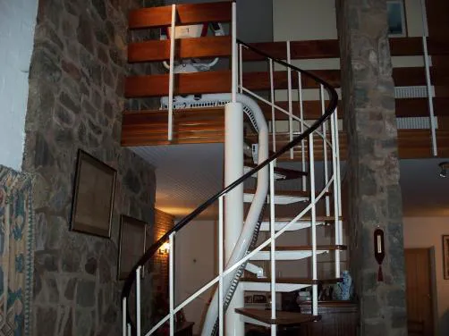 Flow X curved stairlift rail fitted to a spiral staircase