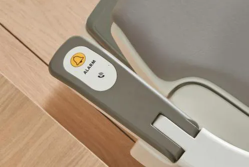 Alarm button on the HomeGlide stairlift armrest for the call device