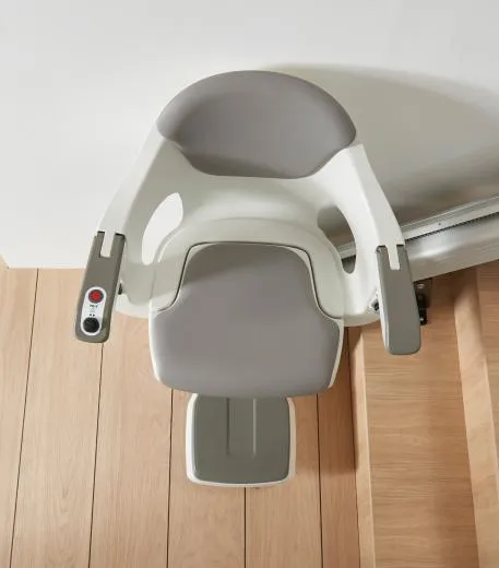 HomeGlide stairlift seen from above at the foot of the stairs